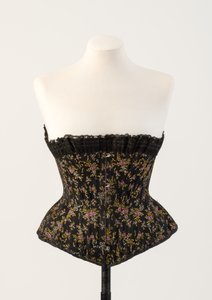 Black woven silk boned corset, with tiny blue and pink flowers, 1890s